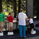 Kids and mom at sand table