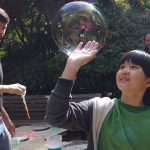 Kid playing with bubbles