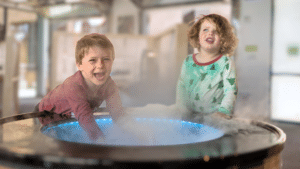 Two children at the Fog Bowl exhibit