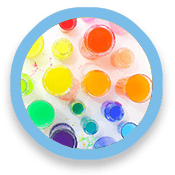Water glasses full of colored liquid