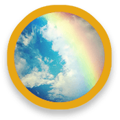 Rainbow across cloudy sky