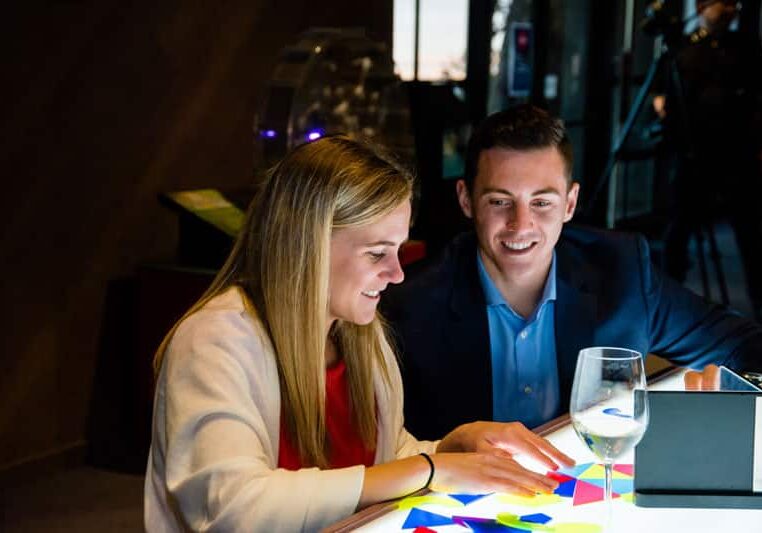 corporate-events-people-light-table Young professionals play with light table.